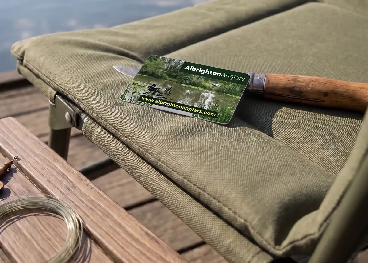 Albrighton Anglers membership card on a lakeside fishing chair