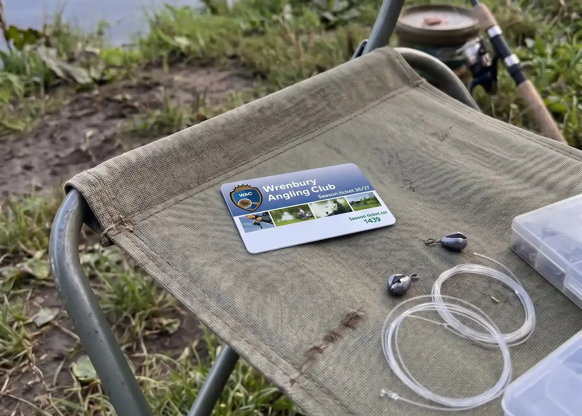 Angling club membership card with club logo on a fishing chair