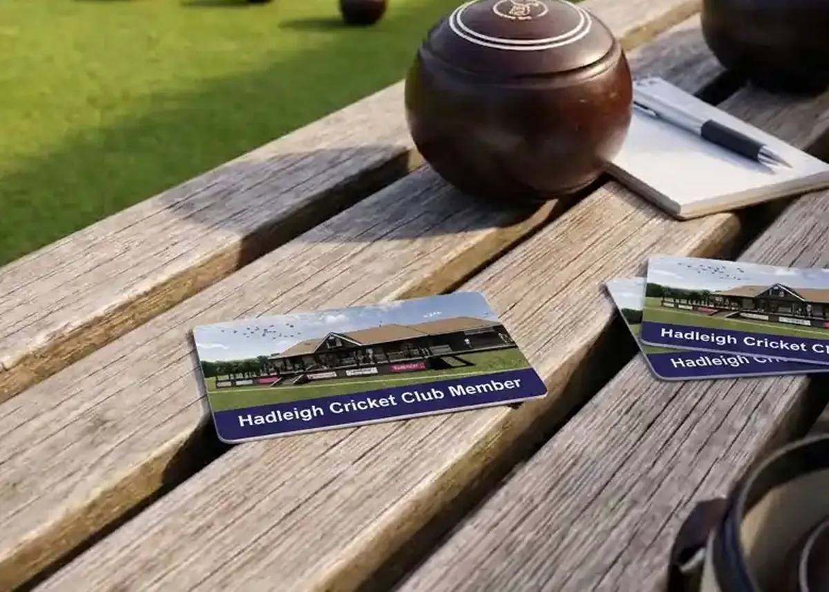 Hadleigh Cricket Club membership cards on a clubhouse bench