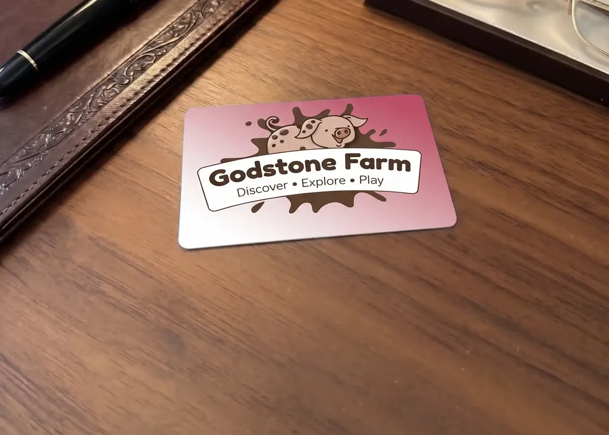 Godstone Farm membership card on a wooden desk