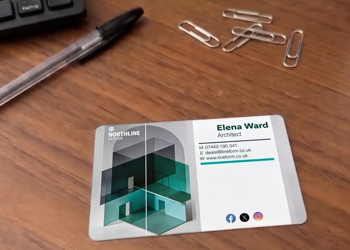 Architect plastic business card on a desk with paper clips