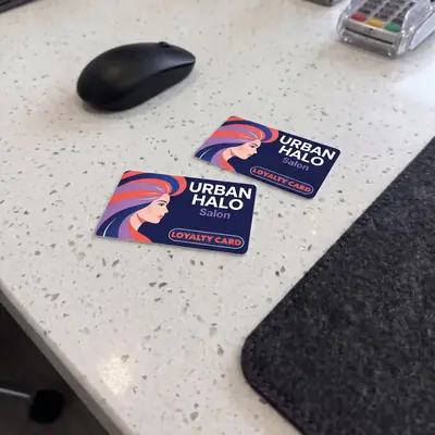 Urban Halo hair salon loyalty cards on a reception counter