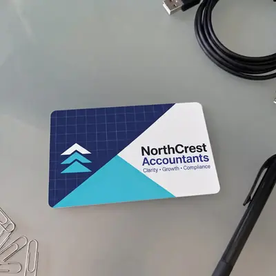 NorthCrest Accountants plastic business card on a desk