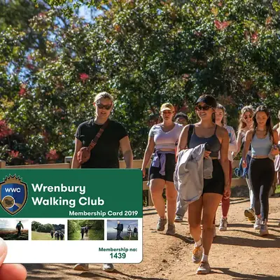 a plastic membership card for Wrenbury Walking club with logo and photos